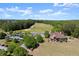 Beautiful aerial view of the clubhouse and golf course on a sunny day at 146 Cedar Woods Trl, Canton, GA 30114