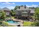 Aerial view of the estate showcasing the pool, outdoor spaces, and manicured grounds at 146 Cedar Woods Trl, Canton, GA 30114
