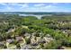 Aerial view of the neighborhood showcasing the lush landscaping, lake and golf course views at 146 Cedar Woods Trl, Canton, GA 30114