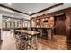 Entertaining bar area with rustic brick accents, wooden countertops, and bar stool seating at 146 Cedar Woods Trl, Canton, GA 30114