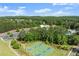 Aerial view of the basketball court, nestled among lush greenery near the pool at 146 Cedar Woods Trl, Canton, GA 30114