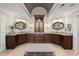 Elegant bathroom with and vanities, dark wood cabinetry, and granite countertops at 146 Cedar Woods Trl, Canton, GA 30114