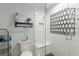Modern bathroom featuring a stylish glass shower with mosaic tile accent wall and built-in shelf at 146 Cedar Woods Trl, Canton, GA 30114