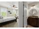 Comfortable bedroom with neutral tones, plantation shutters, and a ceiling fan at 146 Cedar Woods Trl, Canton, GA 30114