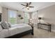 Comfortable bedroom with neutral tones, plantation shutters, and a ceiling fan at 146 Cedar Woods Trl, Canton, GA 30114