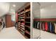 Custom walk-in closet with built-in shelving and ample space for storage and organization at 146 Cedar Woods Trl, Canton, GA 30114