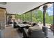 Covered patio with comfortable seating, ceiling fans, and a view of the backyard at 146 Cedar Woods Trl, Canton, GA 30114