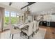Elegant dining room with large windows, hardwood floors, and modern chandelier at 146 Cedar Woods Trl, Canton, GA 30114