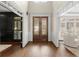 Welcoming foyer featuring hardwood floors, detailed trim, and a view into the living spaces at 146 Cedar Woods Trl, Canton, GA 30114