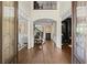 Grand foyer with high ceilings, hardwood floors, and elegant staircase at 146 Cedar Woods Trl, Canton, GA 30114