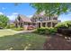 Charming traditional home with manicured landscaping and inviting front porch at 146 Cedar Woods Trl, Canton, GA 30114
