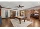 Spacious game room with a pool table and brick accents, perfect for entertainment at 146 Cedar Woods Trl, Canton, GA 30114
