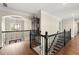 Elegant hallway with hardwood floors, decorative railing and trim, and a view to the outside at 146 Cedar Woods Trl, Canton, GA 30114