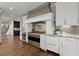 Gourmet kitchen boasts stainless steel appliances, granite countertops, and custom cabinetry at 146 Cedar Woods Trl, Canton, GA 30114