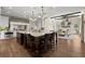 Spacious kitchen boasts an expansive island, seating for four, and modern lighting at 146 Cedar Woods Trl, Canton, GA 30114
