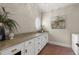 Convenient laundry room with ample counter space, cabinets, and a sink at 146 Cedar Woods Trl, Canton, GA 30114
