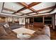 Expansive living room with coffered ceilings and a large entertainment center at 146 Cedar Woods Trl, Canton, GA 30114