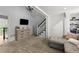 Comfortable living room with white staircase, neutral tones, and natural light at 146 Cedar Woods Trl, Canton, GA 30114
