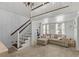 Charming living room with hardwood floors, shiplap ceiling, natural light, and a staircase to the loft at 146 Cedar Woods Trl, Canton, GA 30114