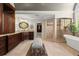 Luxurious main bathroom features dual vanities, a soaking tub, and a separate walk-in shower at 146 Cedar Woods Trl, Canton, GA 30114