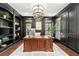 Stylish home office with custom built-ins, hardwood floors, and a large wooden desk at 146 Cedar Woods Trl, Canton, GA 30114
