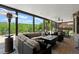 Expansive covered outdoor seating area with a fireplace, ceiling fans and views of the backyard at 146 Cedar Woods Trl, Canton, GA 30114