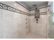 This primary bathroom has a shower with multiple shower heads and tiled niche at 146 Cedar Woods Trl, Canton, GA 30114