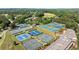 Large aerial view of the tennis courts complex, surrounded by lush landscaping at 146 Cedar Woods Trl, Canton, GA 30114