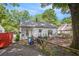 The backyard features a tree and an exterior view of the house with a gray roof at 212 South Se Ave, Marietta, GA 30060