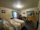 A bedroom contains a bed, wooden floors, curtains, and assorted furnishings at 212 South Se Ave, Marietta, GA 30060