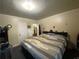 Cozy bedroom featuring a comfortable bed and carpeted floors and plenty of natural light at 212 South Se Ave, Marietta, GA 30060