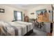 This bedroom features one window, light yellow walls, and a queen bed with a gray comforter at 212 South Se Ave, Marietta, GA 30060