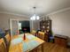 Cozy dining room with hardwood floors, a decorative chandelier, and classic furnishings at 212 South Se Ave, Marietta, GA 30060