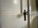 An antique glass doorknob with ornate hardware on a white door adds vintage charm at 212 South Se Ave, Marietta, GA 30060