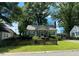 Charming single-Gathering home with a cozy screened porch, a well-maintained lawn, and classic light-colored siding at 212 South Se Ave, Marietta, GA 30060
