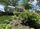 Well-maintained front yard with lush landscaping, flowers, and charming curb appeal at 212 South Se Ave, Marietta, GA 30060