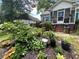 Landscaped front yard with colorful flowers, plants, and decorative accents enhancing curb appeal at 212 South Se Ave, Marietta, GA 30060