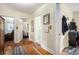 Hallway with hardwood floors, neutral walls, and access to multiple rooms at 212 South Se Ave, Marietta, GA 30060