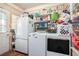 Laundry room with washer, dryer, refrigerator, and shelving at 212 South Se Ave, Marietta, GA 30060