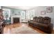 Comfortable living room with hardwood floors, cozy fireplace, and plenty of natural light at 212 South Se Ave, Marietta, GA 30060