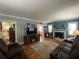Inviting living room featuring a brick fireplace, crown molding, and hardwood floors at 212 South Se Ave, Marietta, GA 30060