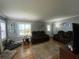 Comfortable living room featuring hardwood floors, area rug, and ample seating at 212 South Se Ave, Marietta, GA 30060