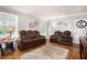 Bright living room featuring hardwood floors, modern decor, and comfortable seating at 212 South Se Ave, Marietta, GA 30060