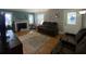 The living room features hardwood floors, a fireplace, plenty of natural light, and comfortable seating at 212 South Se Ave, Marietta, GA 30060