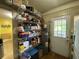 Well-stocked pantry with shelving, laundry facilities, and an exterior door for added convenience at 212 South Se Ave, Marietta, GA 30060