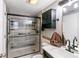 Updated bathroom featuring a glass-enclosed shower and contemporary fixtures at 1280 W Peachtree Nw St # 810, Atlanta, GA 30309