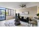 Stylish living room featuring a black sofa, modern decor, and a ceiling fan for added comfort at 1280 W Peachtree Nw St # 810, Atlanta, GA 30309