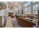 Elegant lobby showcasing high ceilings, comfortable seating, marble floors, and abundant natural light at 1280 W Peachtree Nw St # 810, Atlanta, GA 30309