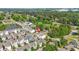 Wide aerial perspective displaying the home's placement within a serene community, featuring a nearby pond and trees at 1436 Belmont Ave, Smyrna, GA 30080