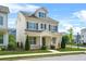 Charming two-story home with neutral siding, dark shutters, manicured lawn and welcoming front porch at 1436 Belmont Ave, Smyrna, GA 30080